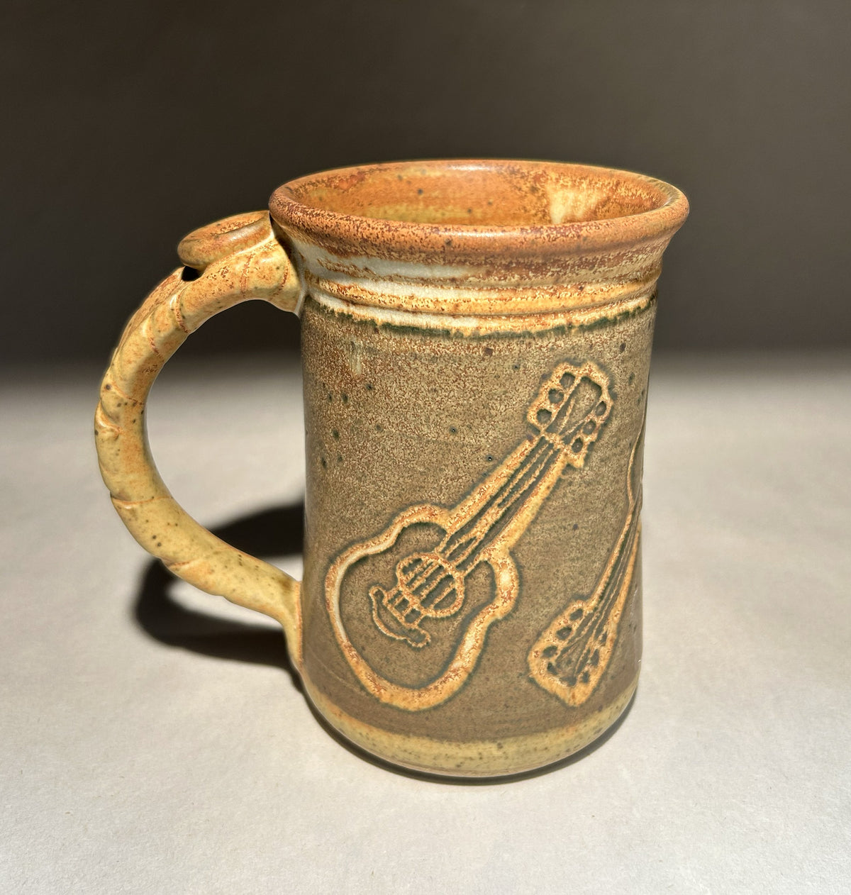 Handmade Pottery Mug with Carved Guitar Underglaze Design
