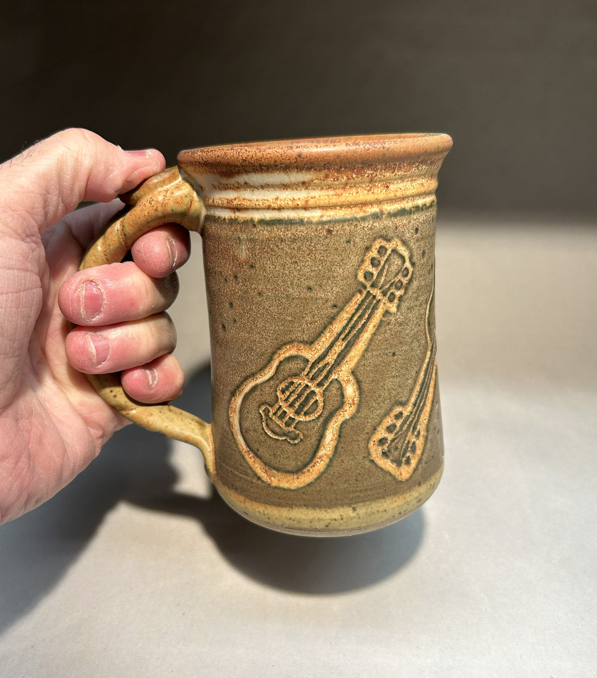 Handmade Pottery Mug with Carved Guitar Underglaze Design
